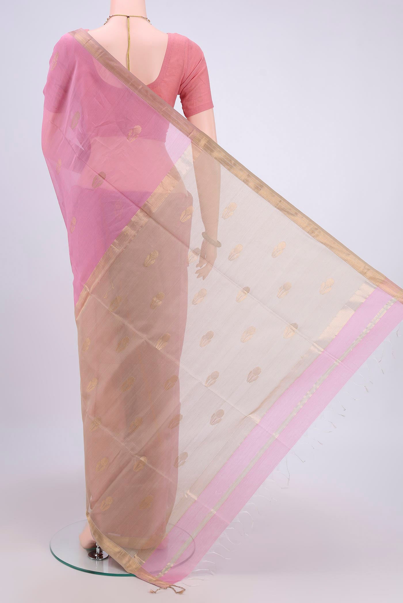 Flat view of Rose pink Maheshwari Silk Cotton Saree with Zari Butta on the body and Zari Border. 