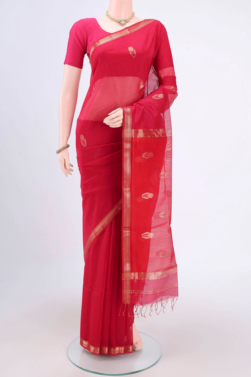 Dark Pink Maheshwari Silk Cotton Saree with Zari Butta on the body and Zari Border.  displayed on a mannequin