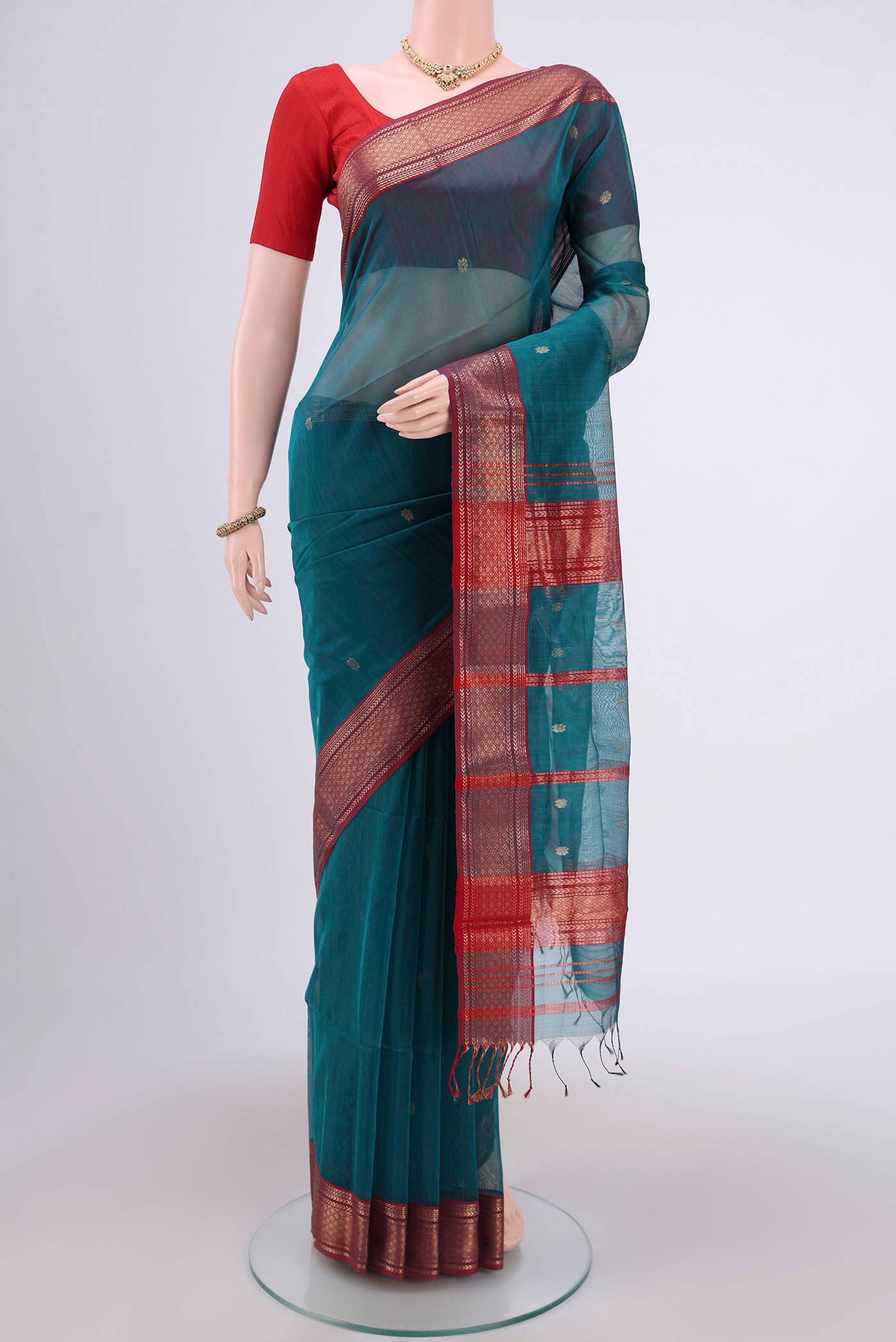 Blue Maheshwari Silk Cotton Saree with Stripes on the body and Zari Border.  displayed on a mannequin