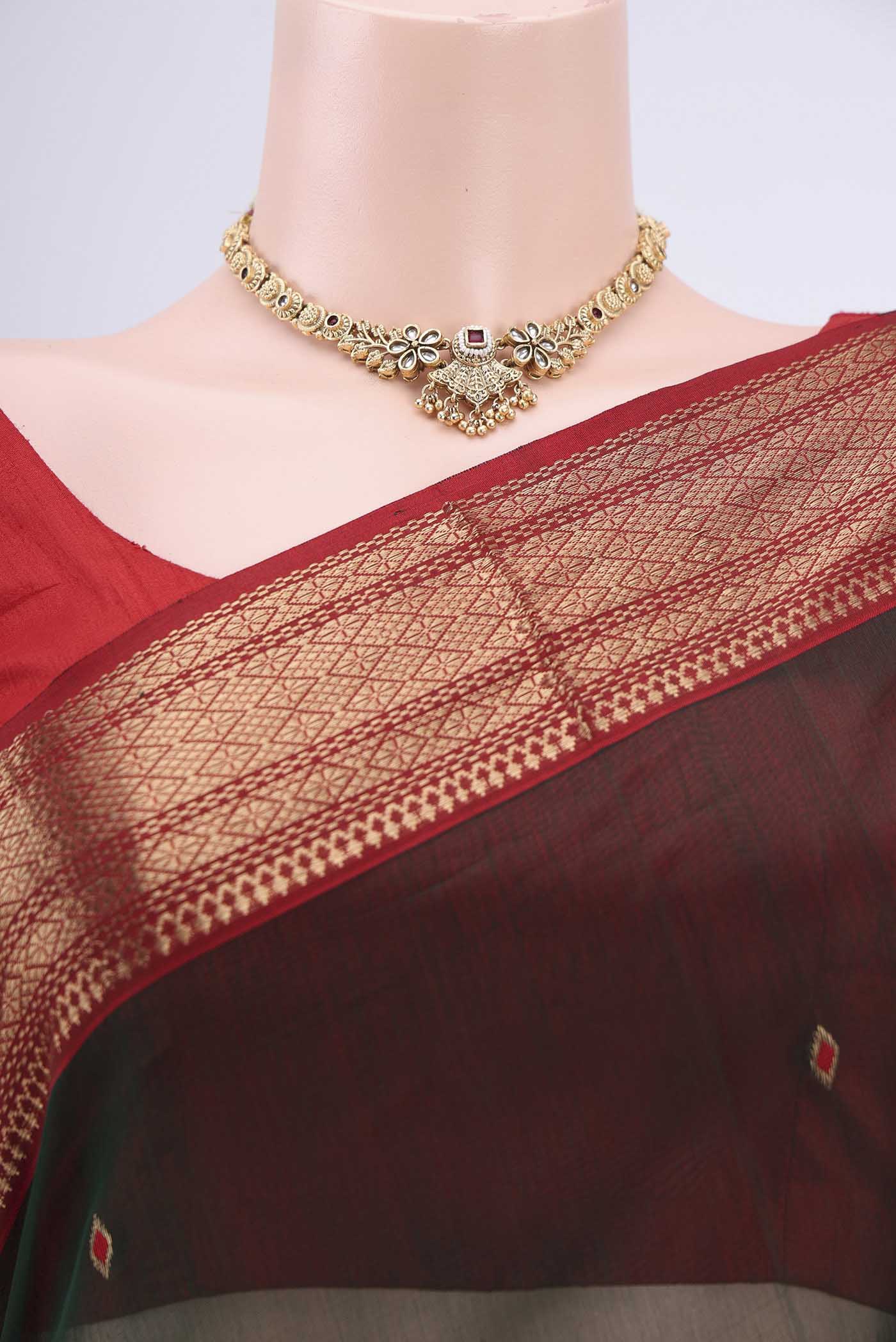Border image of Bottle Green Maheshwari Silk Cotton Saree with Stripes on the body and Zari Border. 
