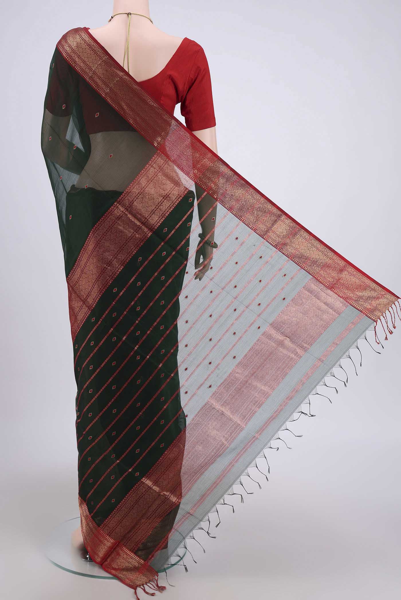 Flat view of Bottle Green Maheshwari Silk Cotton Saree with Stripes on the body and Zari Border. 