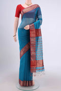 Blue Maheshwari Silk Cotton Saree with Stripes on the body and Zari Border.  displayed on a mannequin