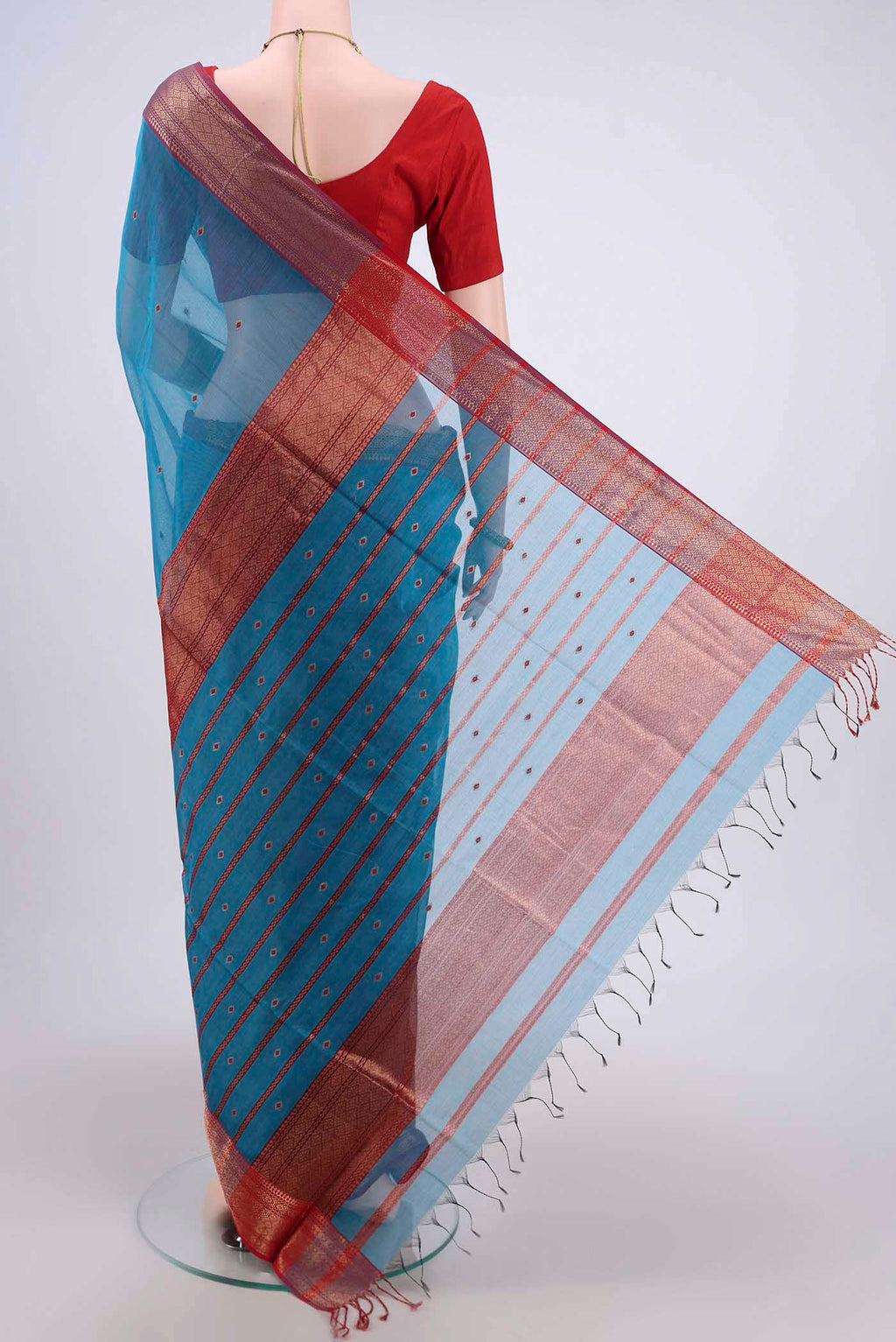 Flat view of Blue Maheshwari Silk Cotton Saree with Stripes on the body and Zari Border. 