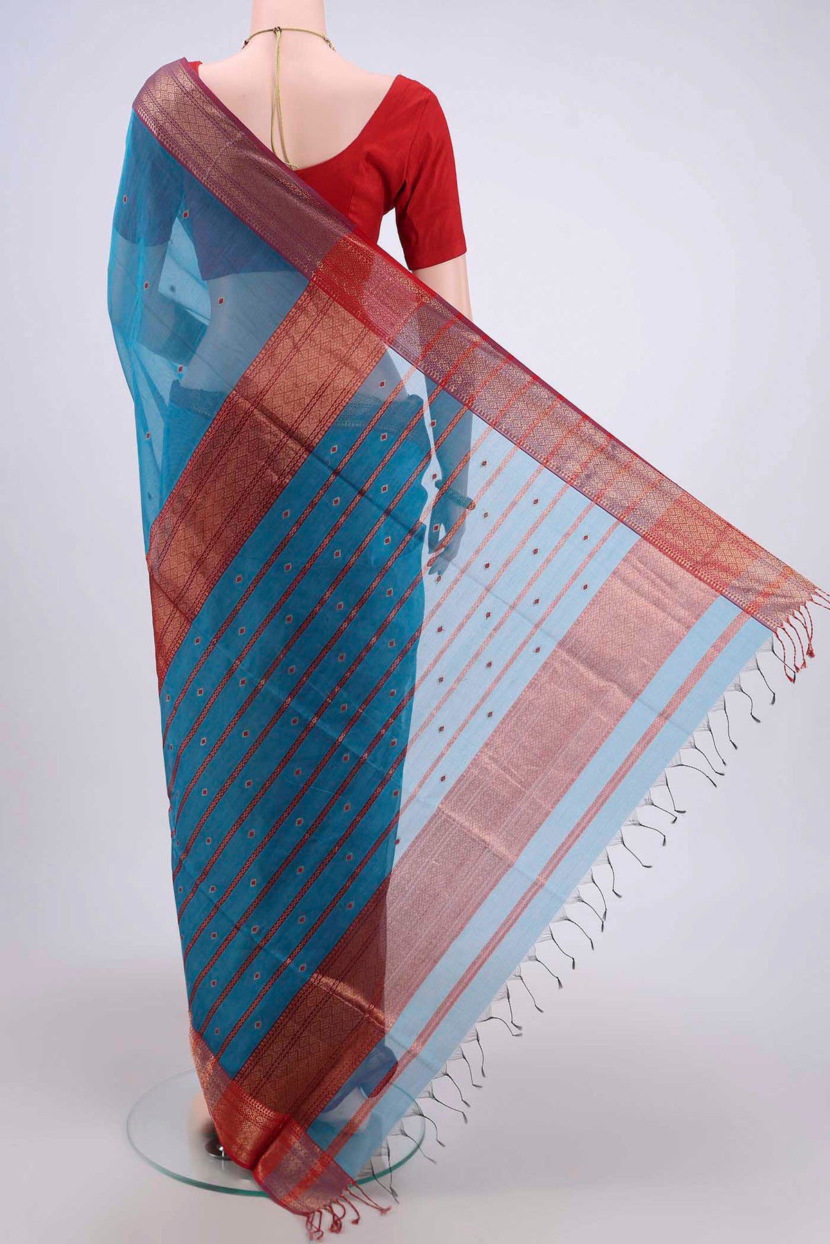 Flat view of Blue Maheshwari Silk Cotton Saree with Stripes on the body and Zari Border. 