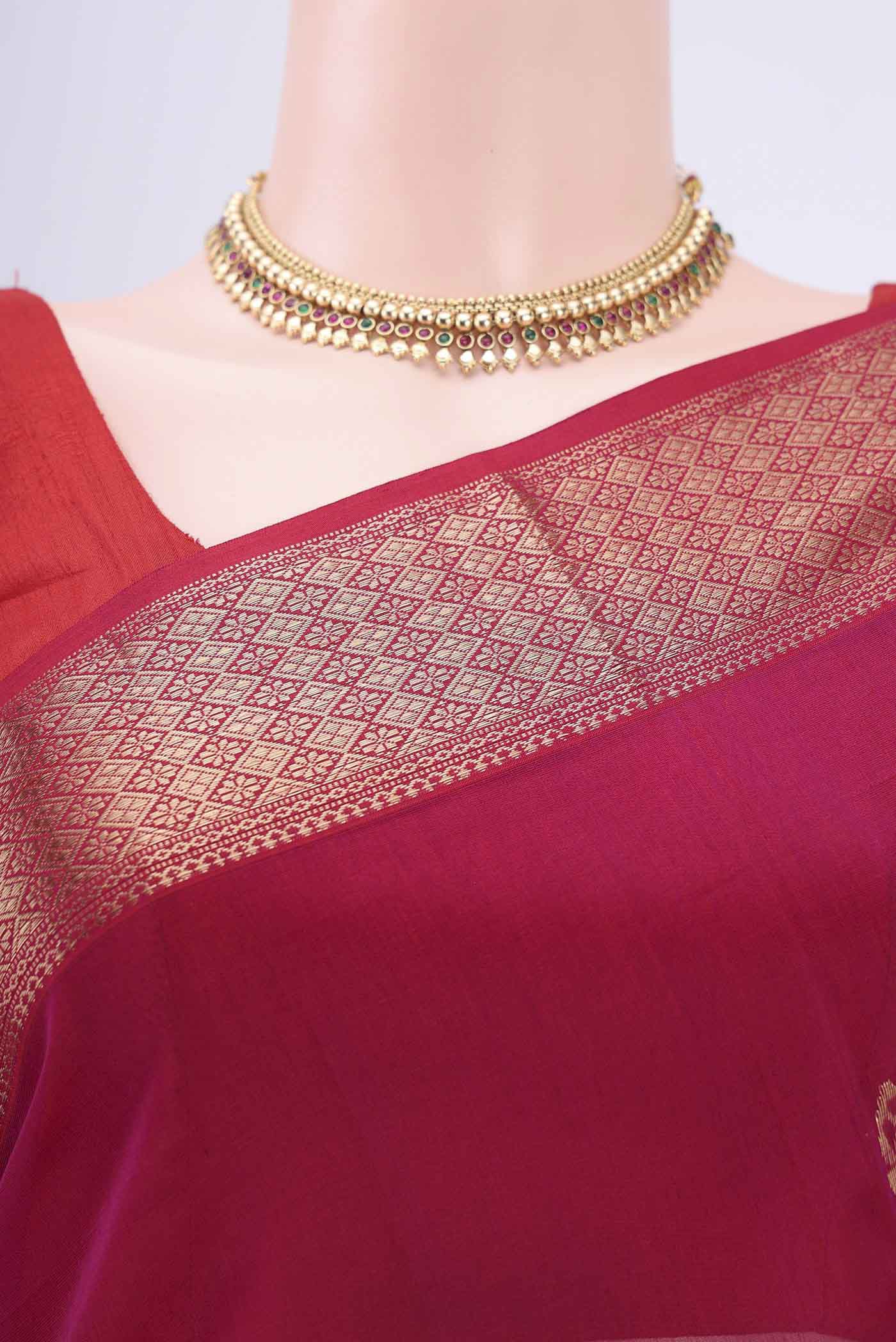 Border image of Magenta Maheshwari Silk Cotton Saree with Zari Butta on the body and Zari Border. 
