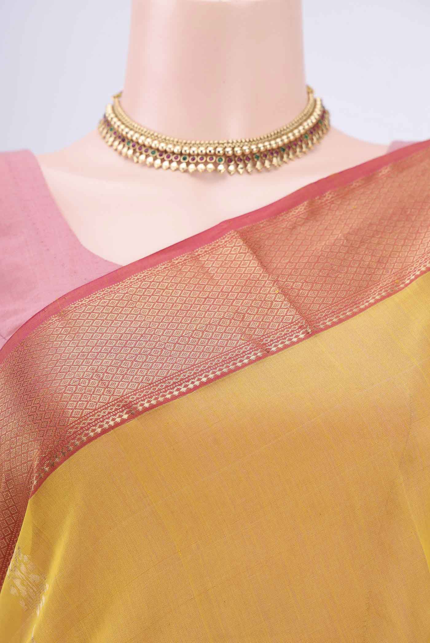 Border image of Mustard Maheshwari Silk Cotton Saree with Zari Butta on the body and Zari Border. 