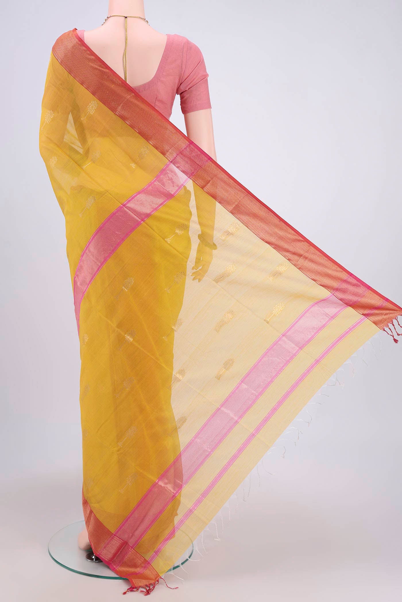 Flat view of Mustard Maheshwari Silk Cotton Saree with Zari Butta on the body and Zari Border. 
