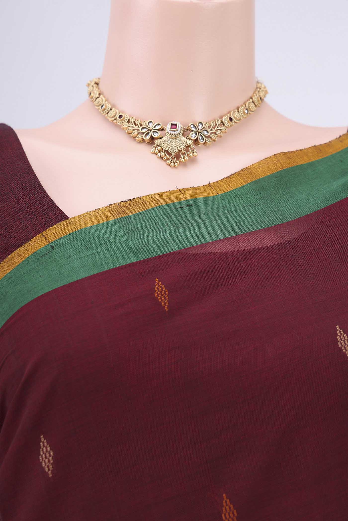 Border image of Maroon Coimbatore Cotton Saree with Thread Butta on the body and Plain Border. 