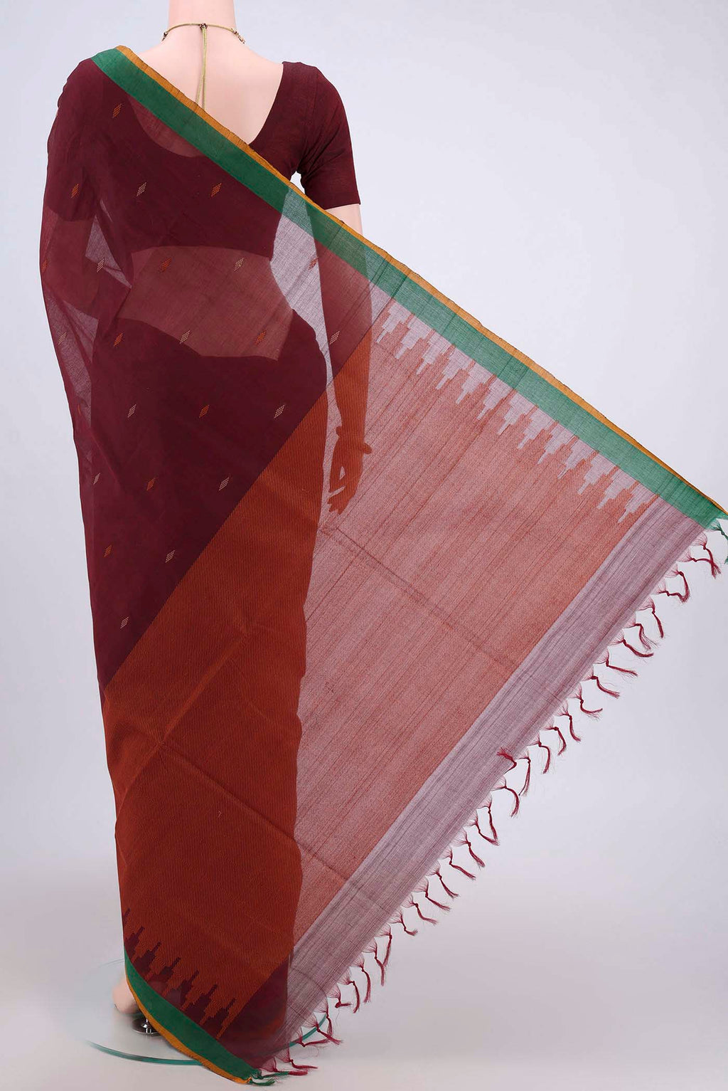 Flat view of Maroon Coimbatore Cotton Saree with Thread Butta on the body and Plain Border. 