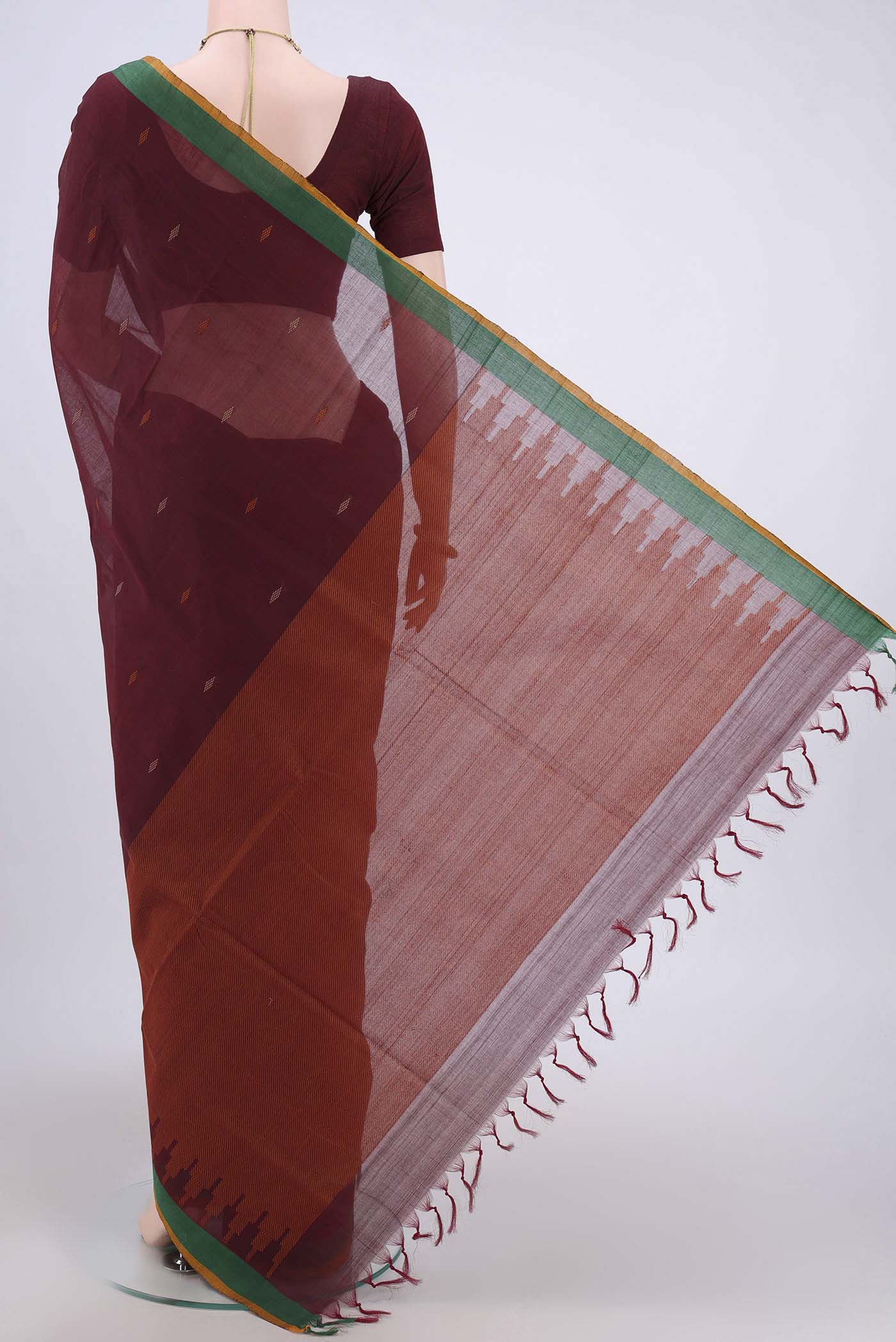 Flat view of Maroon Coimbatore Cotton Saree with Thread Butta on the body and Plain Border. 