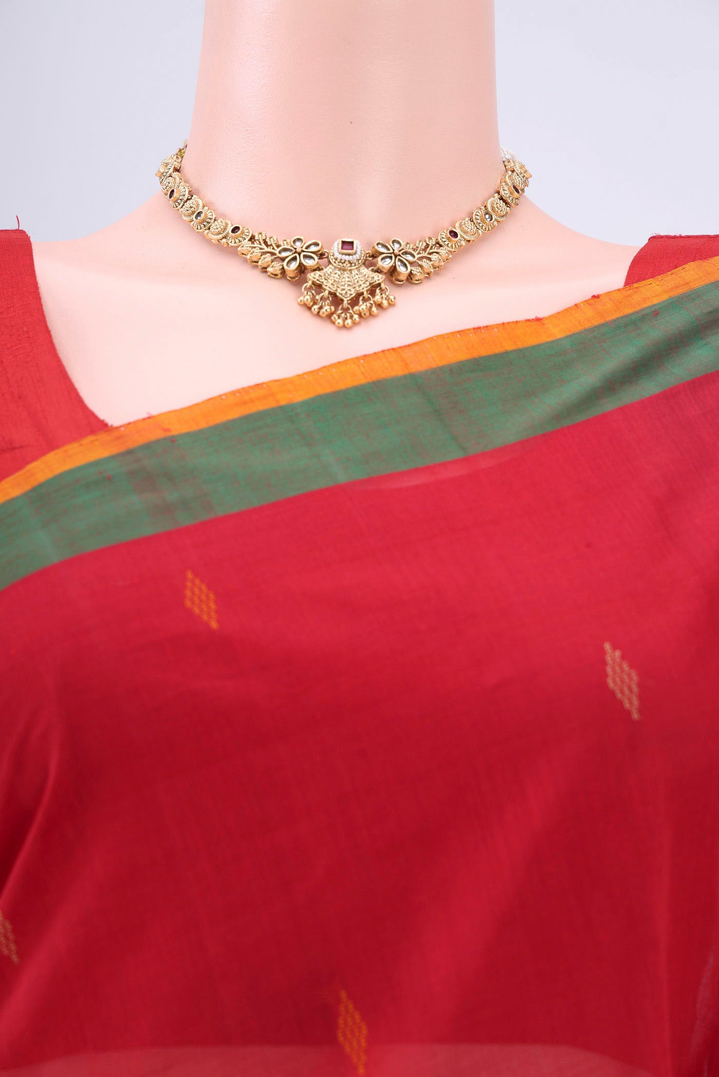 Border image of Red Coimbatore Cotton Saree with Thread Butta on the body and Zari Border. 