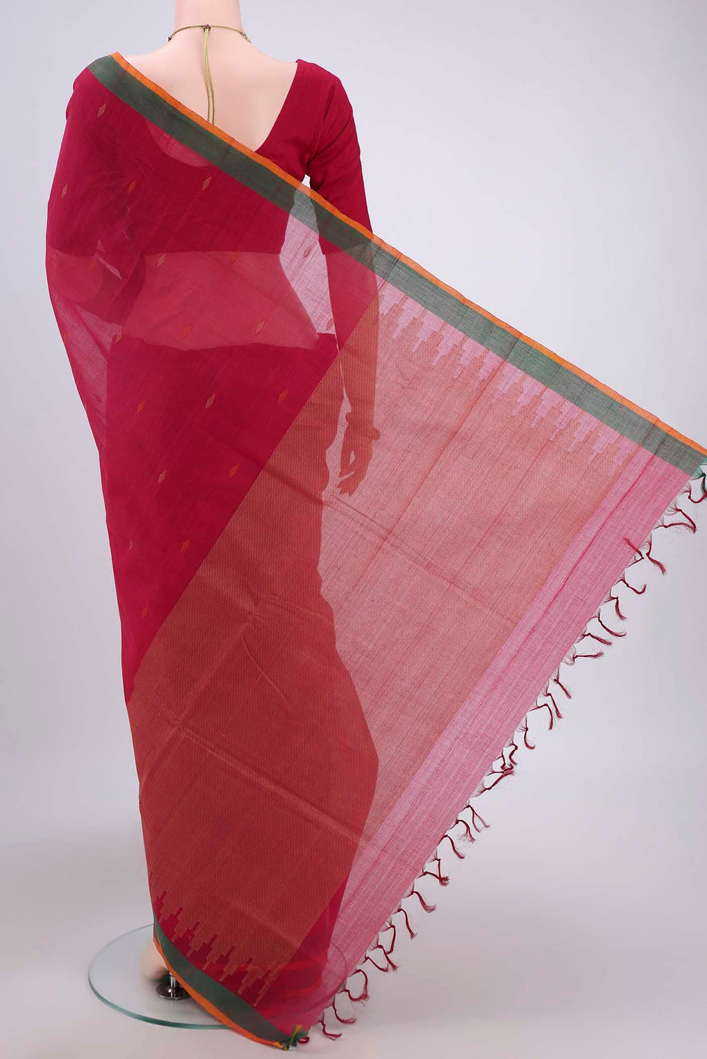 Flat view of Dark Pink Coimbatore Cotton Saree with Thread Butta on the body and Zari Border. 