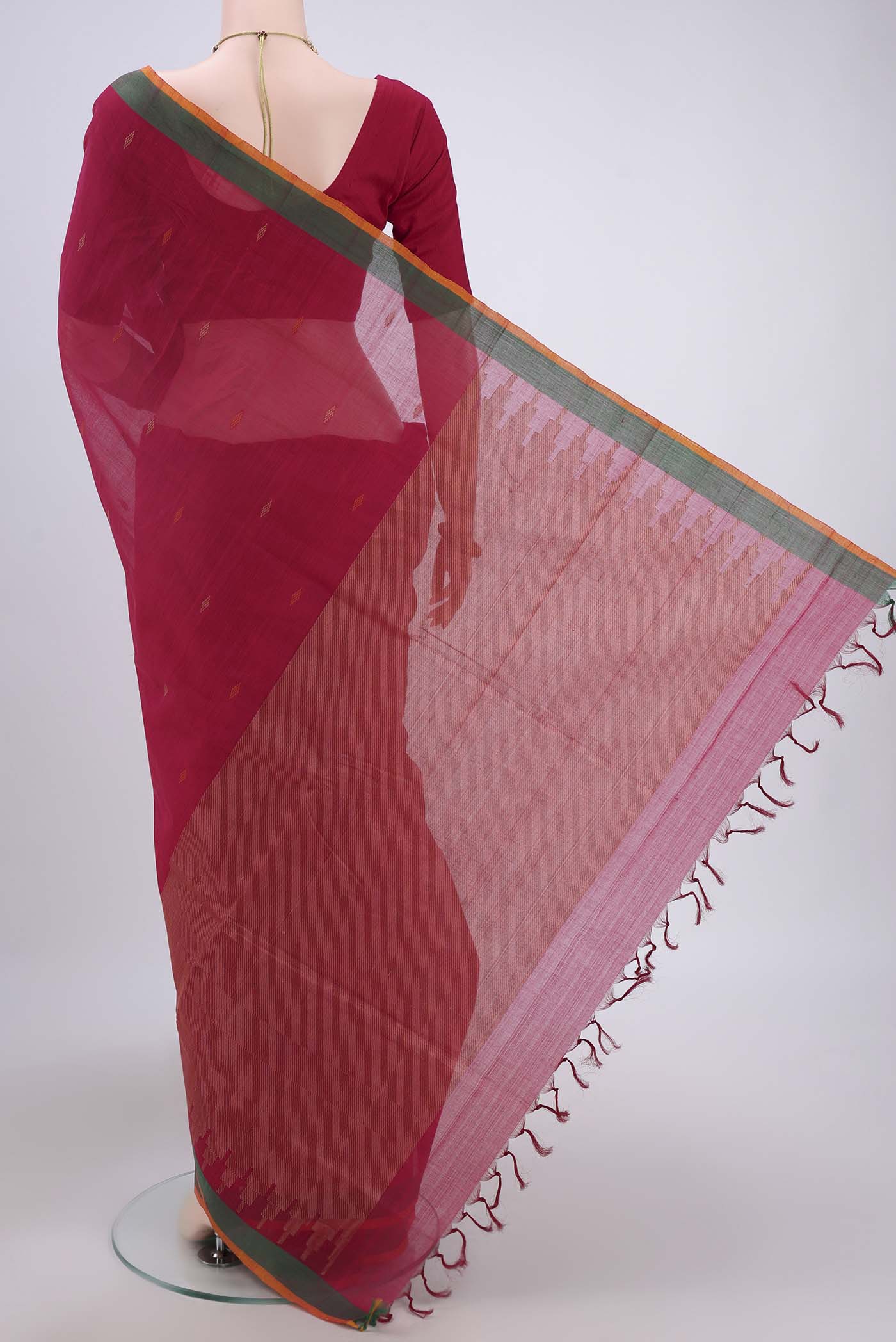 Flat view of Dark Pink Coimbatore Cotton Saree with Thread Butta on the body and Zari Border. 