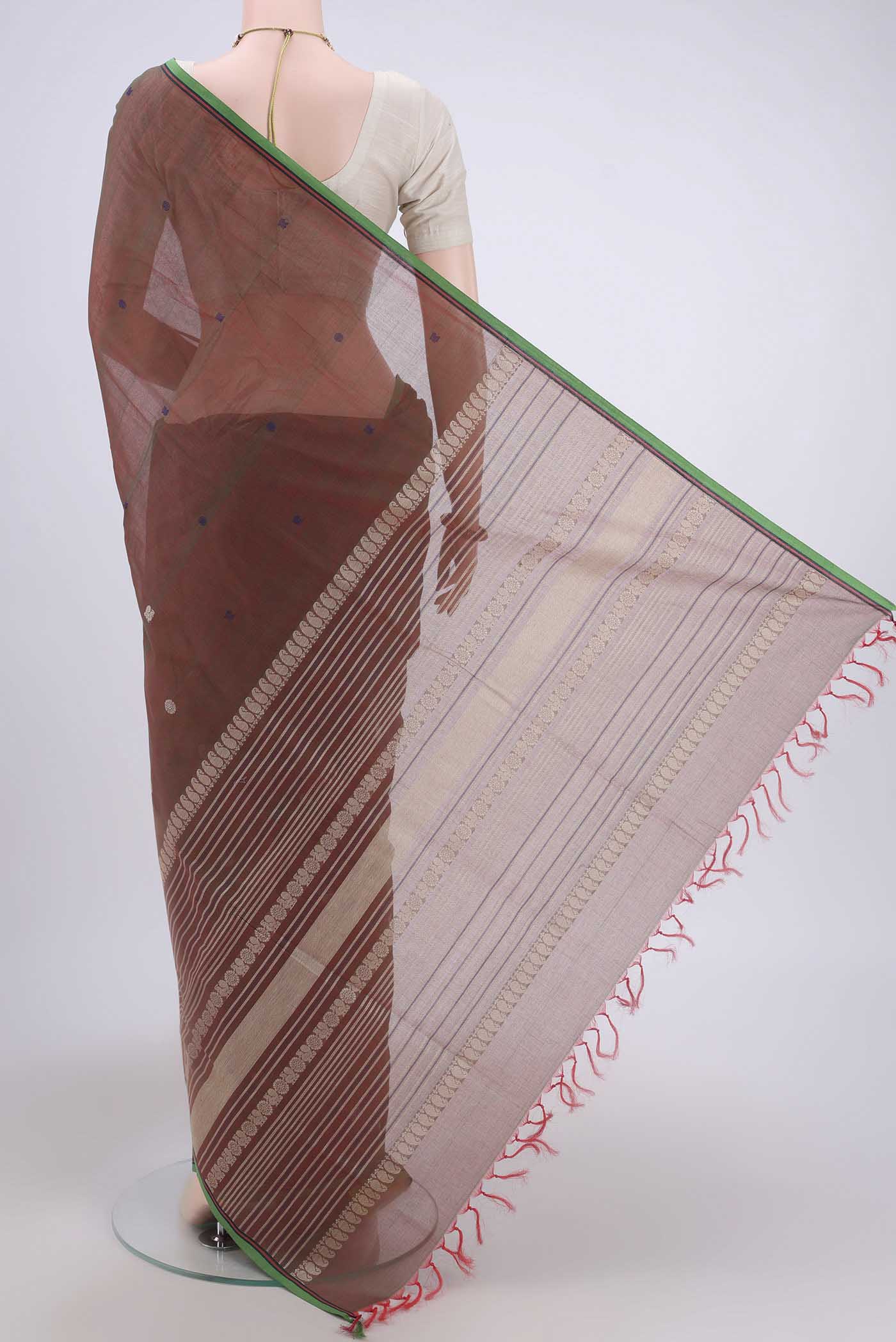 Flat view of Rust Coimbatore Cotton Saree with Thread Butta on the body and Plain Border. 