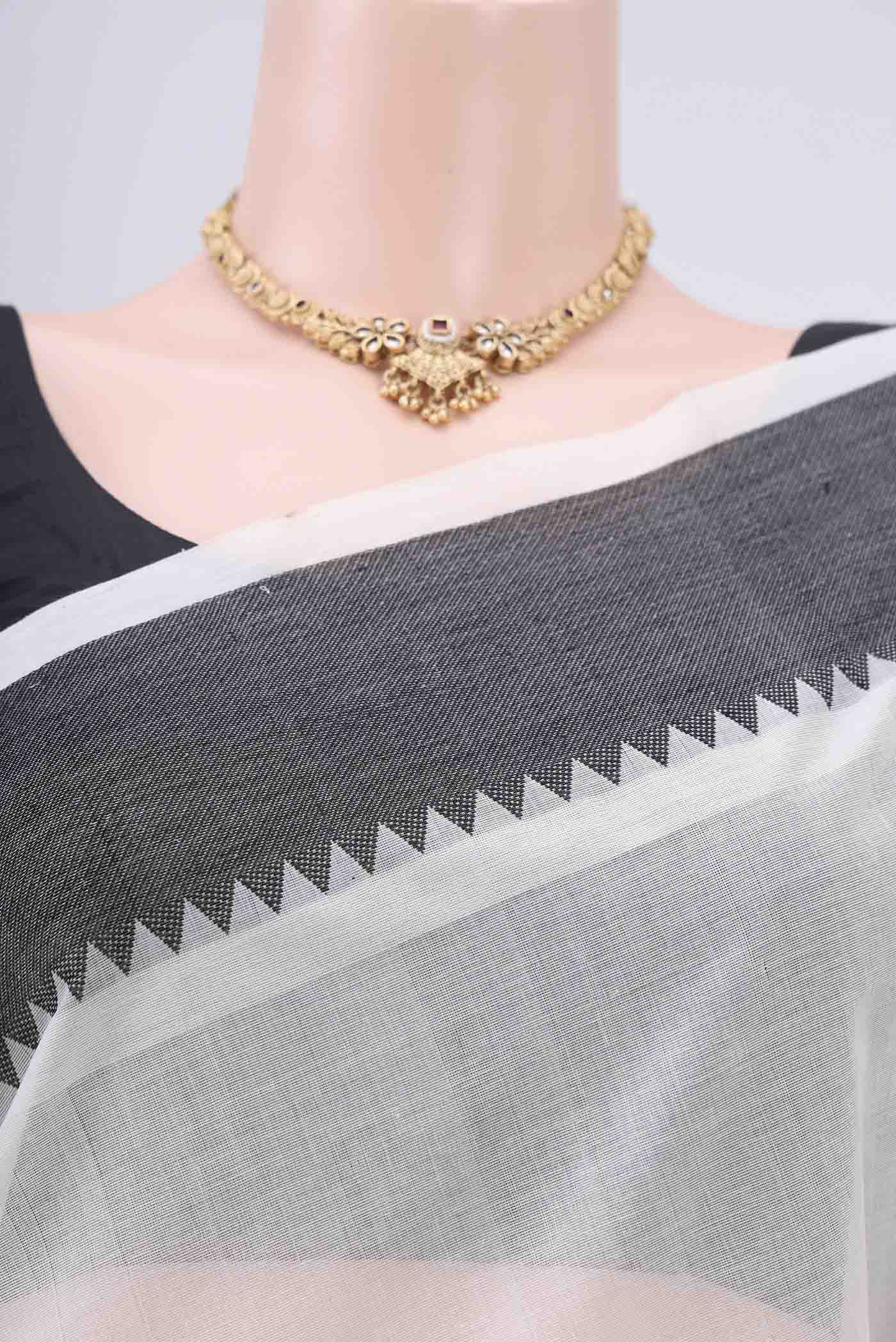 Border image of Off White Coimbatore Cotton Saree with Plain Body and Zari Border. 