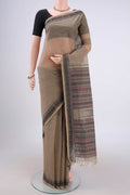 Dark Beige Kanchi Cotton Saree with Stripes on the body and Thread Border.  displayed on a mannequin