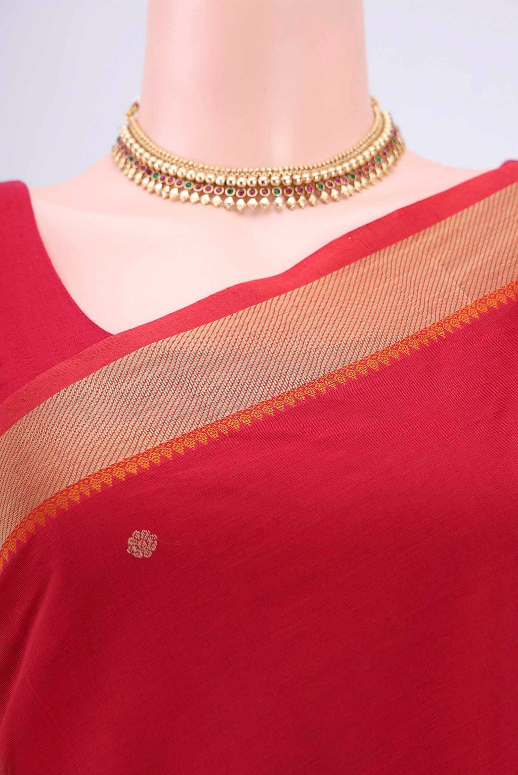 Border image of Red Kanchi Cotton Saree with Thread Butta on the body and Thread Border. 