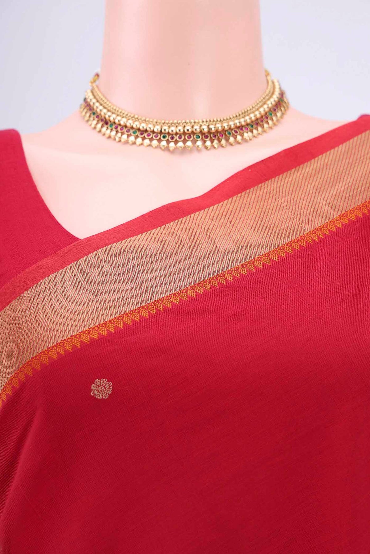 Border image of Red Kanchi Cotton Saree with Thread Butta on the body and Thread Border. 