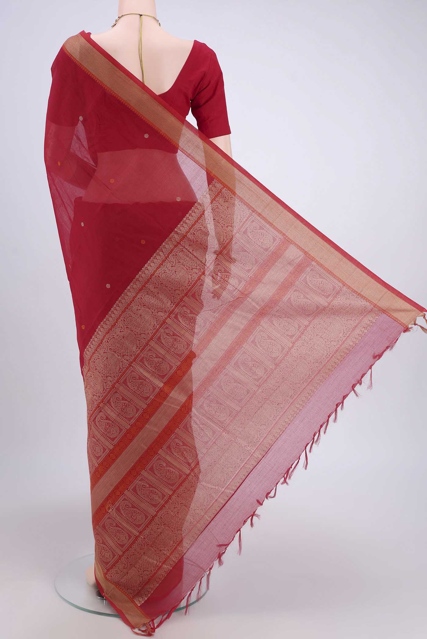 Flat view of Red Kanchi Cotton Saree with Thread Butta on the body and Thread Border. 
