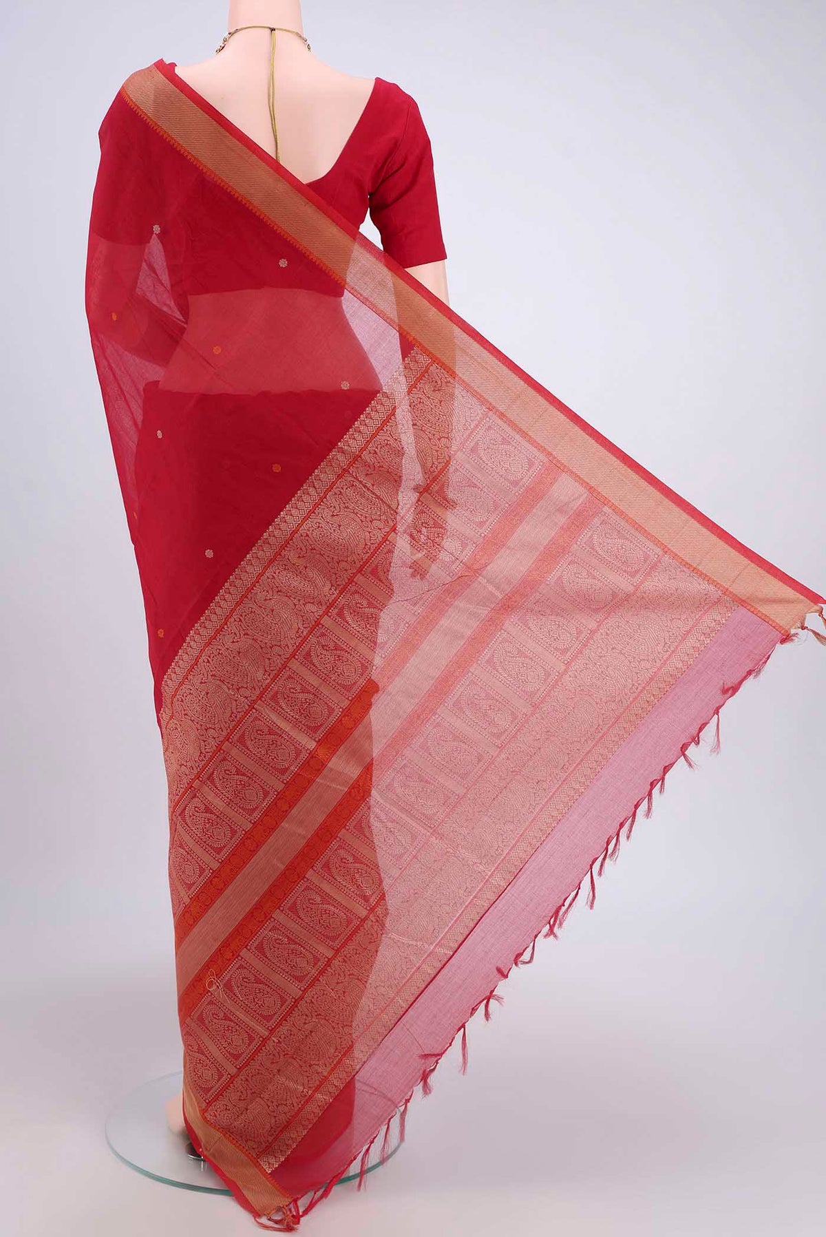 Flat view of Red Kanchi Cotton Saree with Thread Butta on the body and Thread Border. 