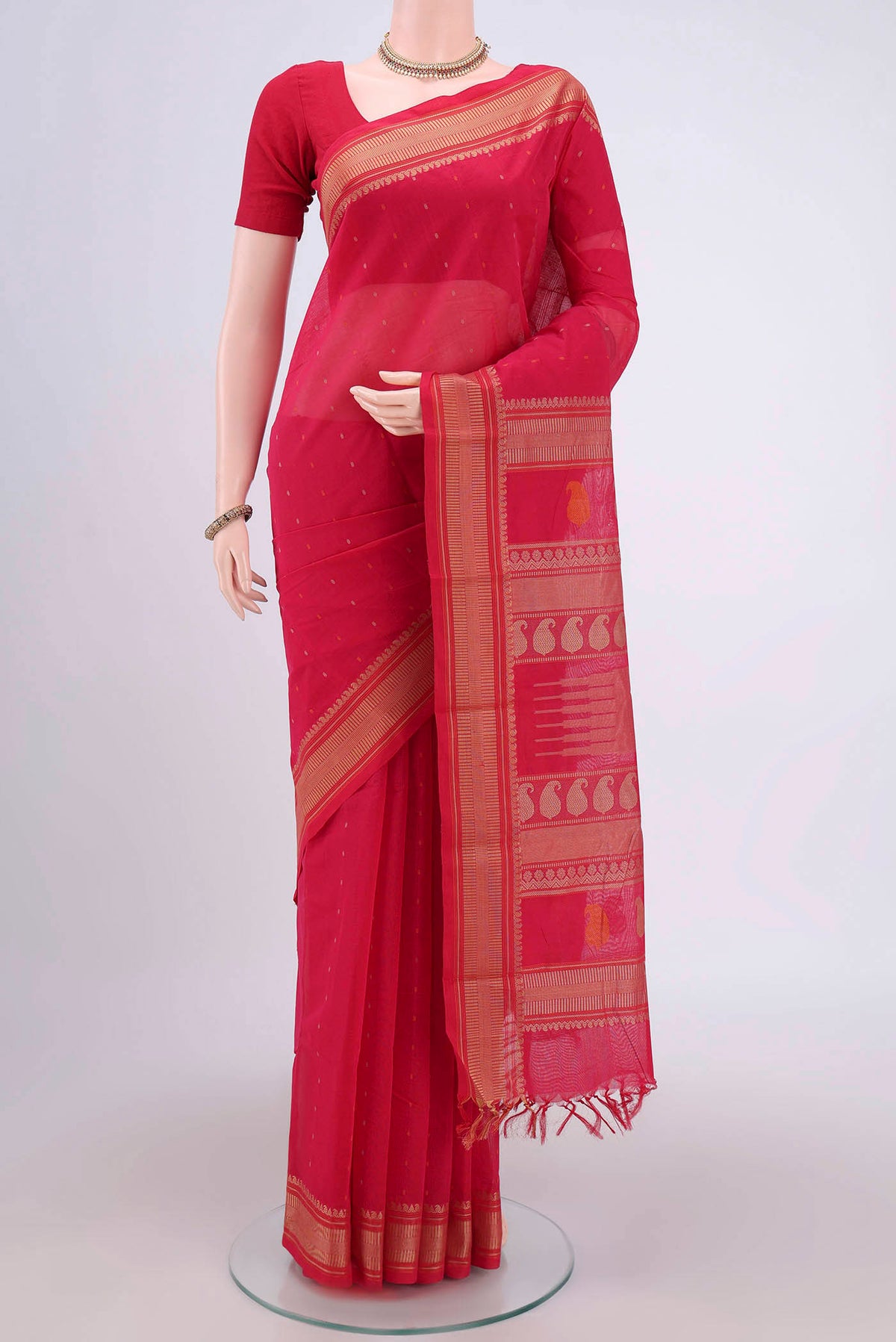 Dark Pink Kanchi Cotton Saree with Thread Butta on the body and Thread Border.  displayed on a mannequin