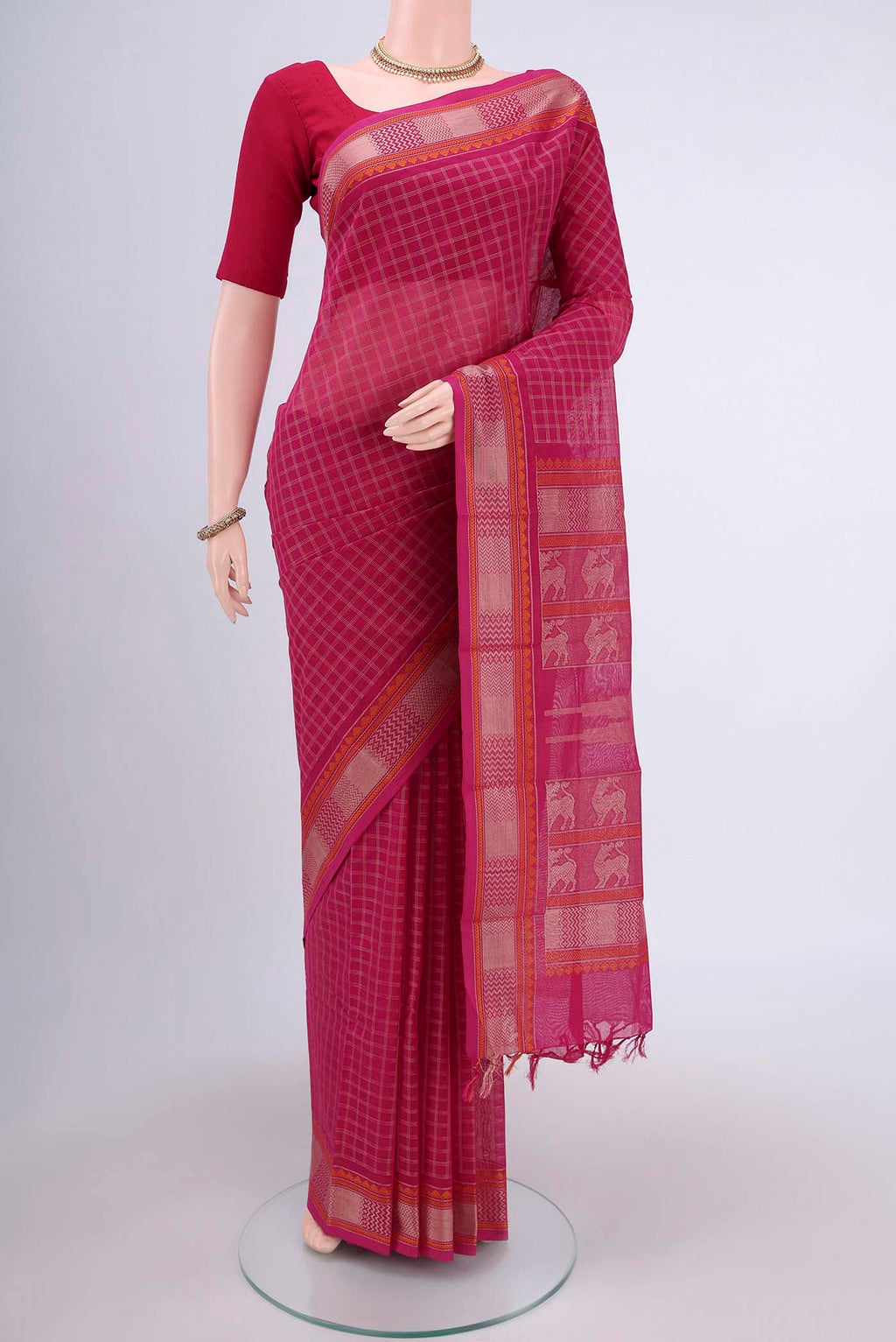 Dark Pink Kanchi Cotton Saree with Checked design on the body and Thread Border.  displayed on a mannequin