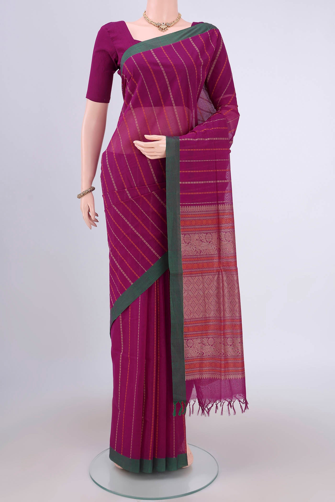 Magenta Coimbatore Cotton Saree with Stripes on the body and Zari Border.  displayed on a mannequin