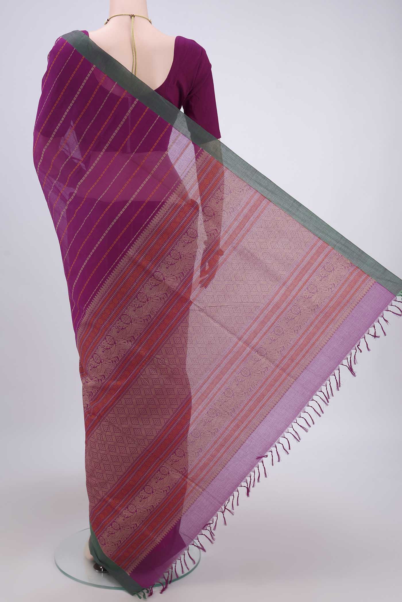 Flat view of Magenta Coimbatore Cotton Saree with Stripes on the body and Zari Border. 
