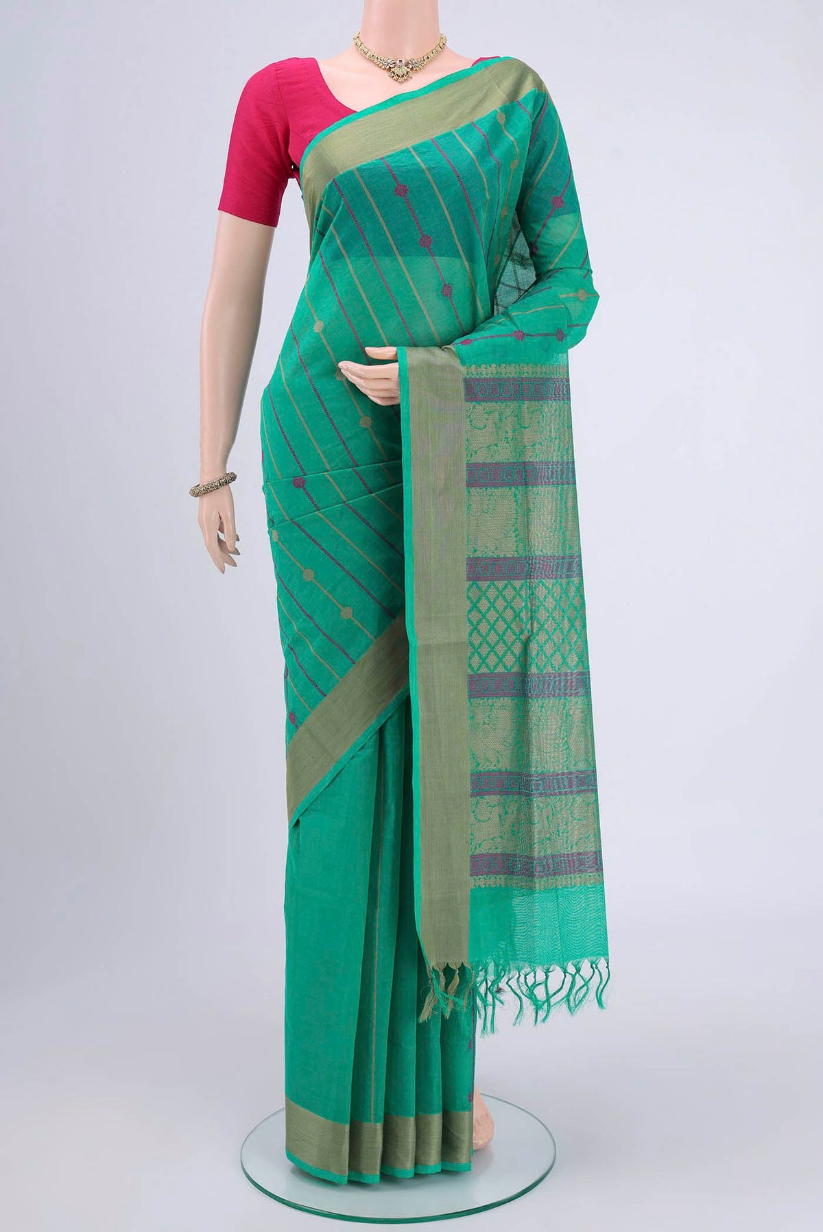 Turquoise Coimbatore Cotton Saree with Stripes on the body and Zari Border.  displayed on a mannequin