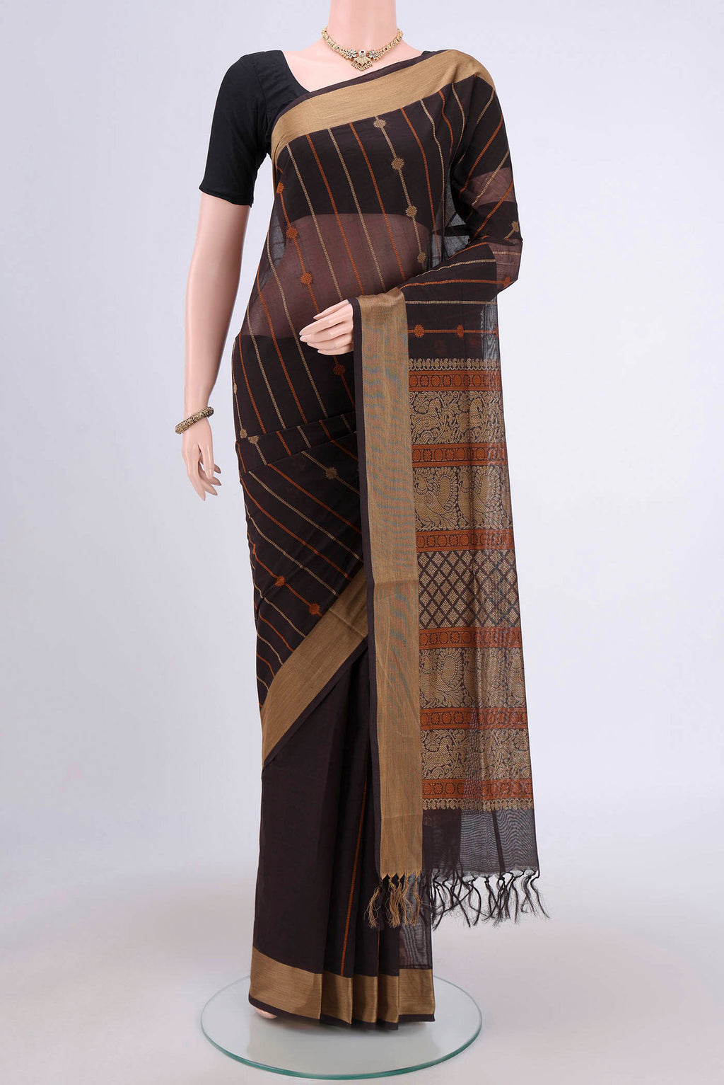 Coffee Brown Coimbatore Cotton Saree with Stripes on the body and Plain Border.  displayed on a mannequin