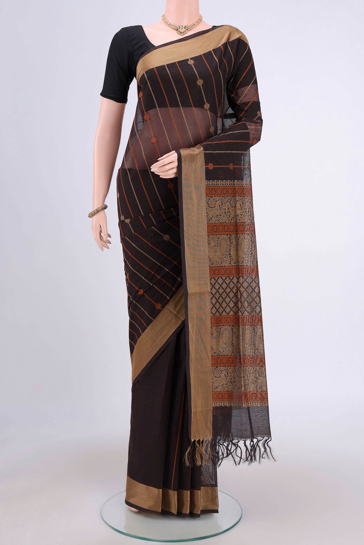Coffee Brown Coimbatore Cotton Saree with Stripes on the body and Plain Border.  displayed on a mannequin