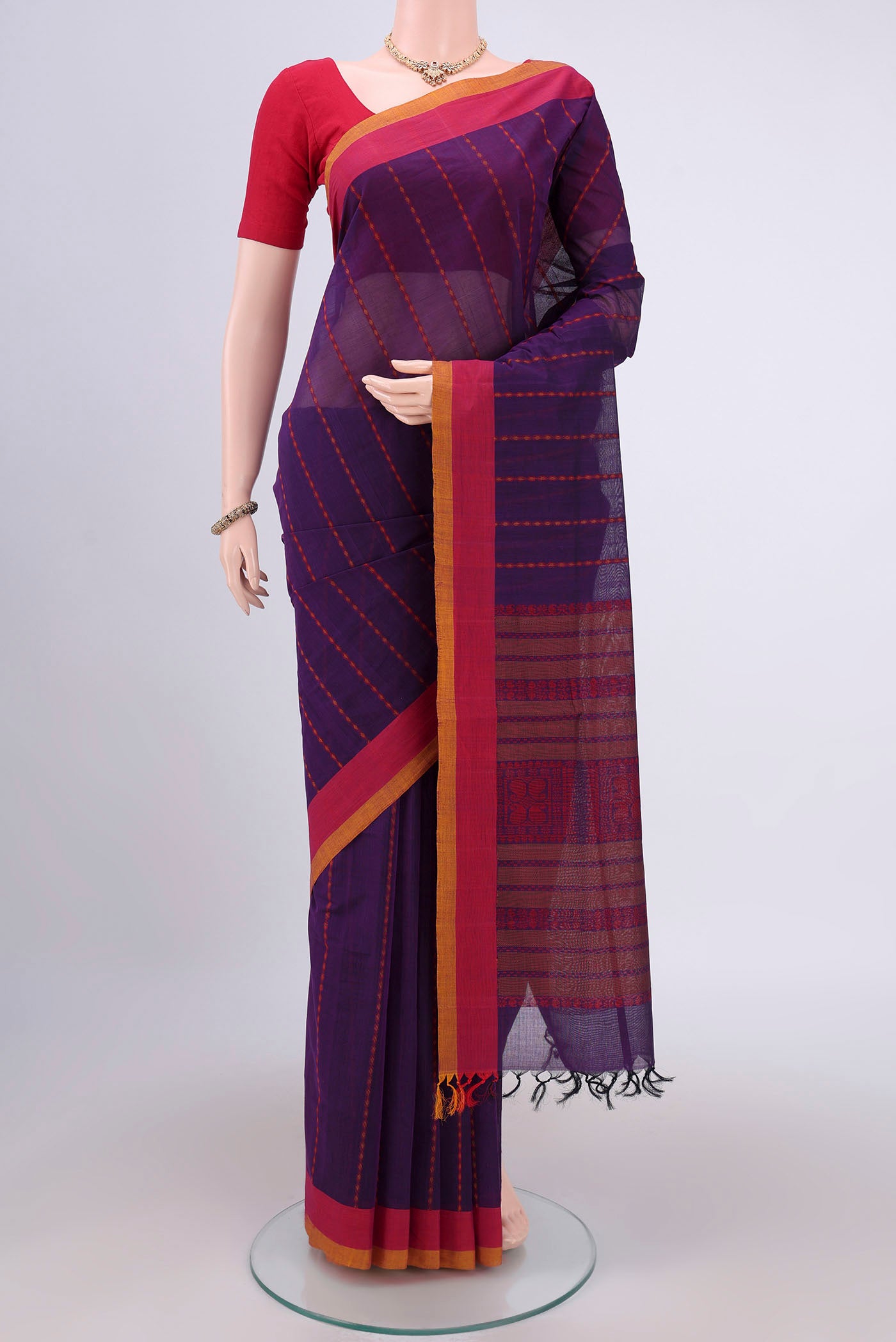 Purple Coimbatore Cotton Saree with Stripes on the body and Zari Border.  displayed on a mannequin