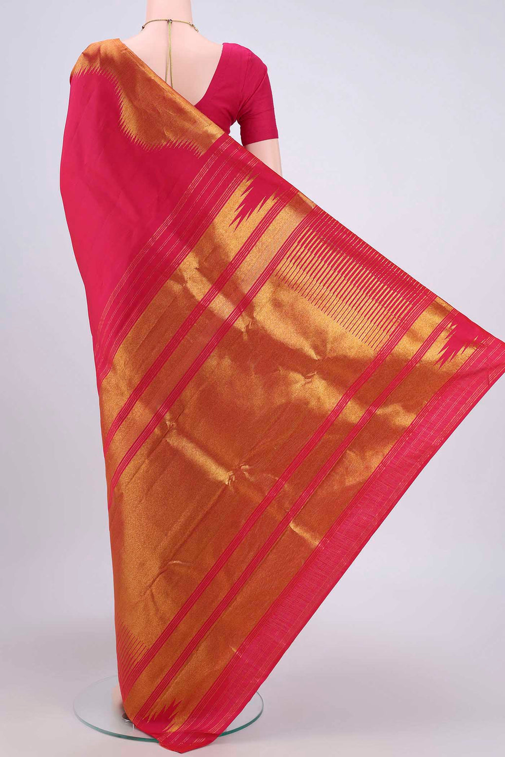 Flat view of Pure Silk Pure Zari Rani Pink Kanjivaram Saree with Plain Body and Zari Border. 
