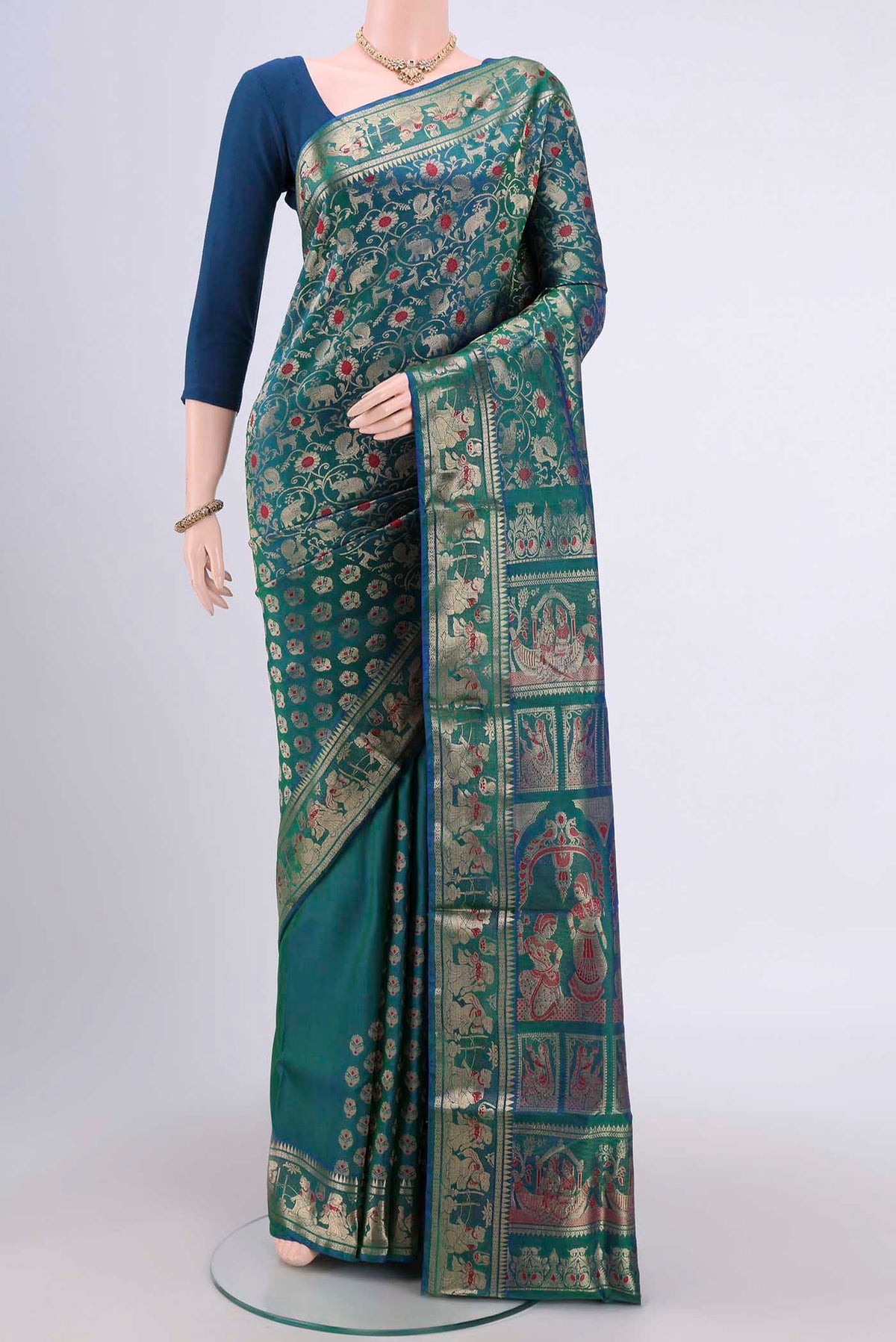 Peacock Blue Dual Tone Baluchari Silk Saree with Zari Brocade on the body and Zari Border.  displayed on a mannequin