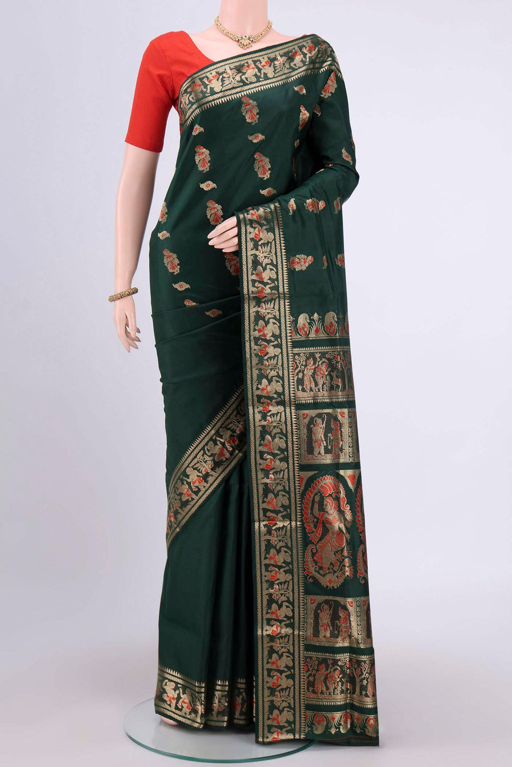 Bottle Green Dual Tone Baluchari Silk Saree with Zari And Thread Butta on the body and Meenakari Border.  displayed on a mannequin