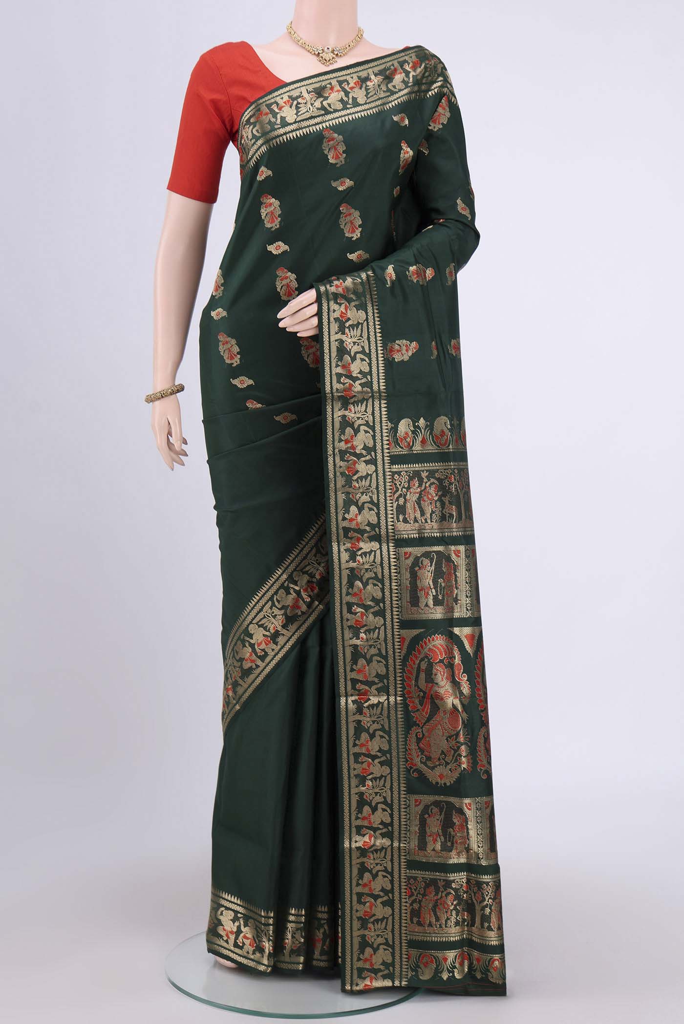 Bottle Green Dual Tone Baluchari Silk Saree with Zari And Thread Butta on the body and Meenakari Border.  displayed on a mannequin