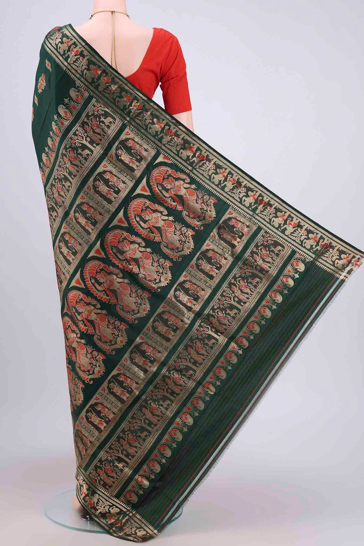 Flat view of Bottle Green Dual Tone Baluchari Silk Saree with Zari And Thread Butta on the body and Meenakari Border. 