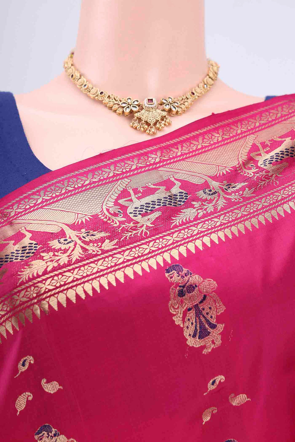 Border image of Rani Pink Dual Tone Baluchari Silk Saree with Zari Butta on the body and Zari Border. 