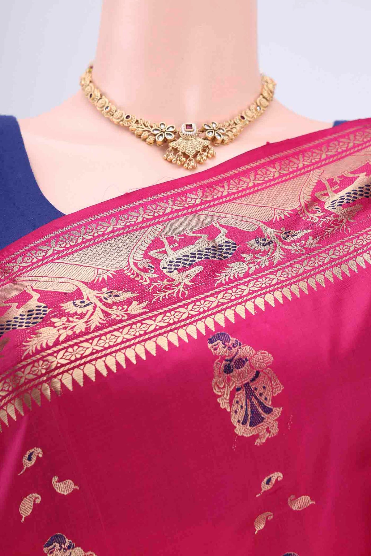 Border image of Rani Pink Dual Tone Baluchari Silk Saree with Zari Butta on the body and Zari Border. 