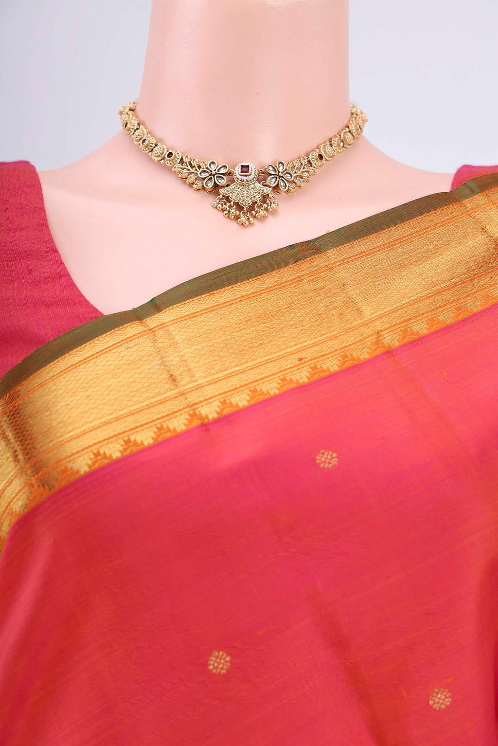 Border image of Pure Silk Pure Zari Orange with Pink Dual Tone Kanjivaram Saree with Zari Butta on the body and Zari Border. 