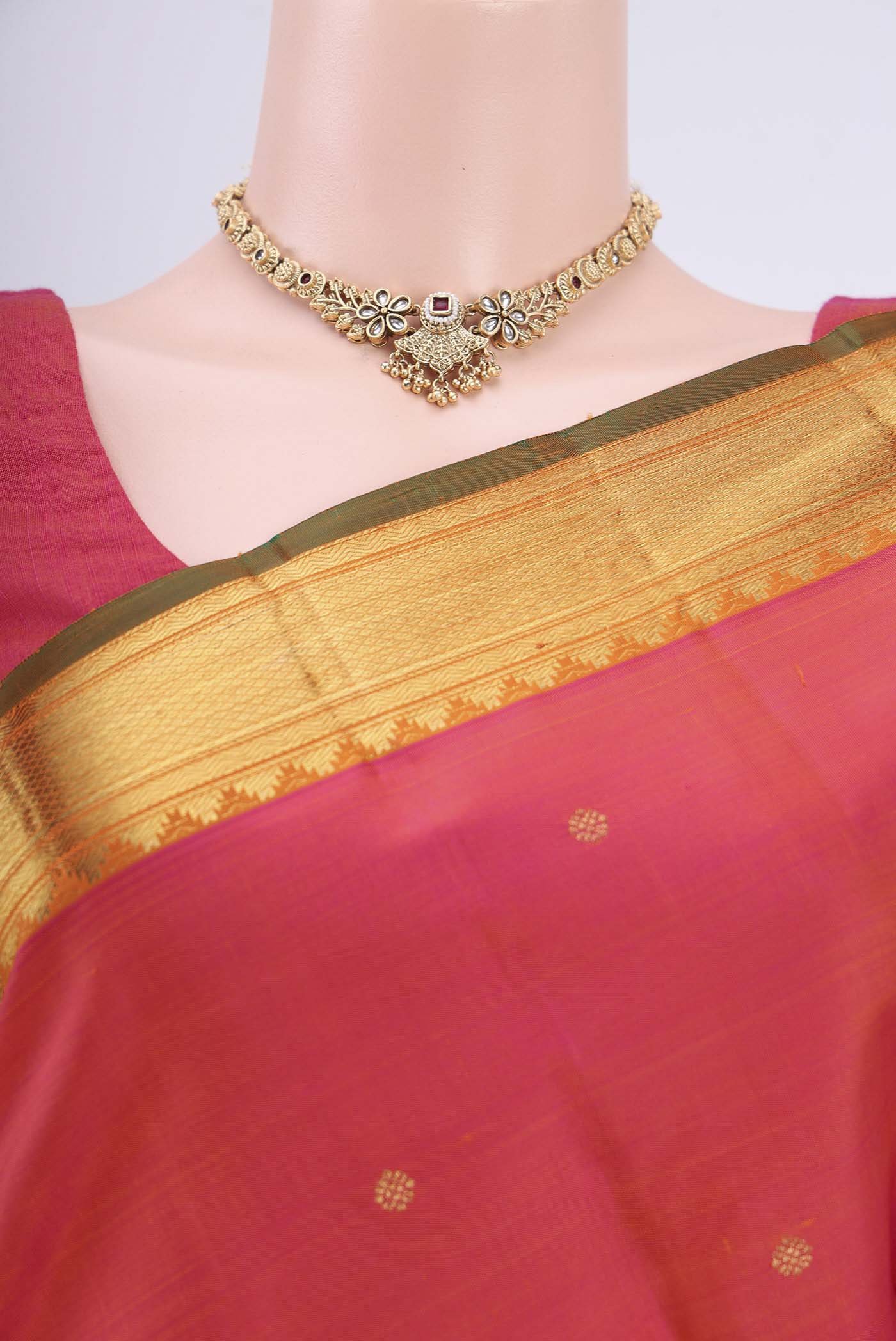 Border image of Pure Silk Pure Zari Orange with Pink Dual Tone Kanjivaram Saree with Zari Butta on the body and Zari Border. 