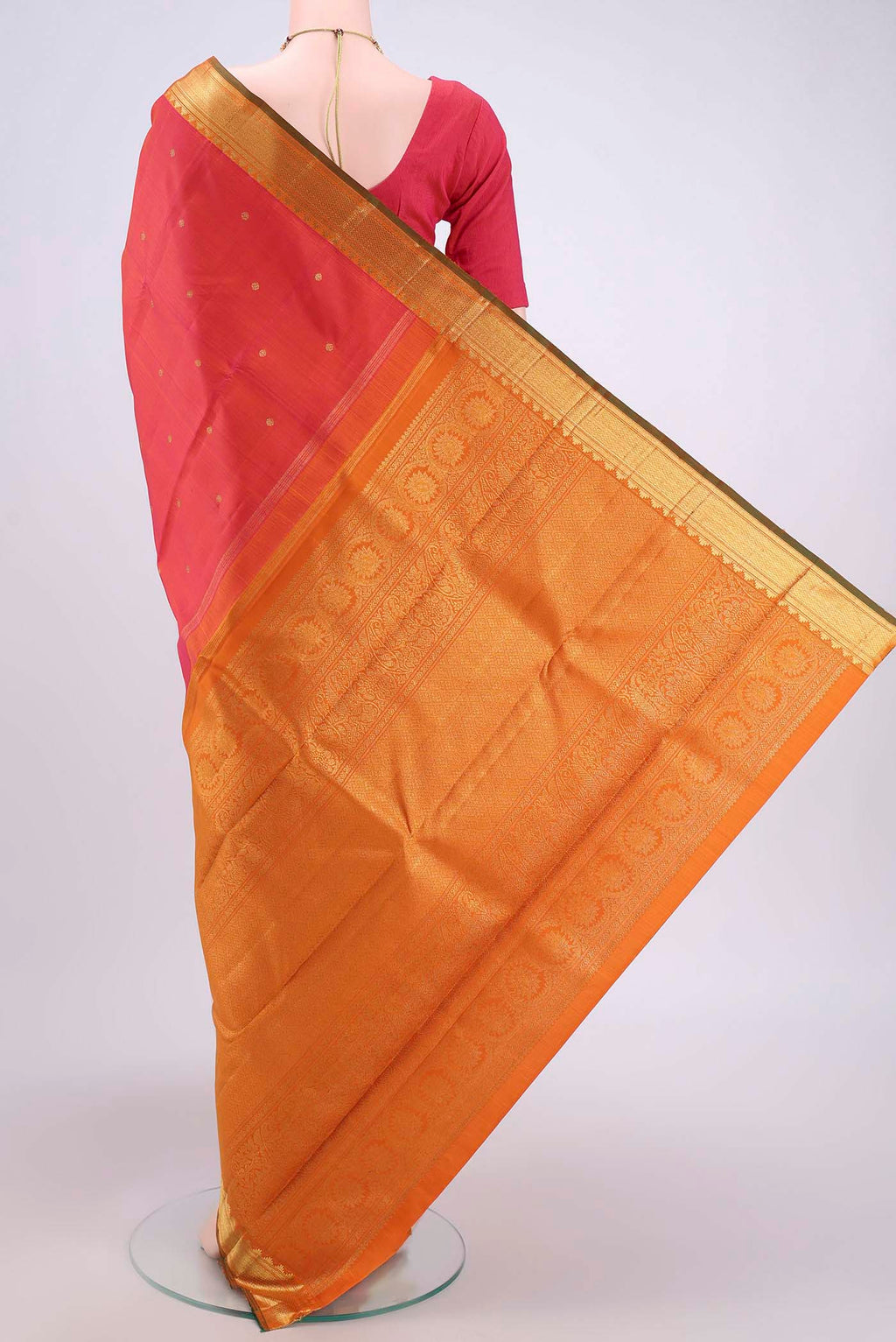 Flat view of Pure Silk Pure Zari Orange with Pink Dual Tone Kanjivaram Saree with Zari Butta on the body and Zari Border. 