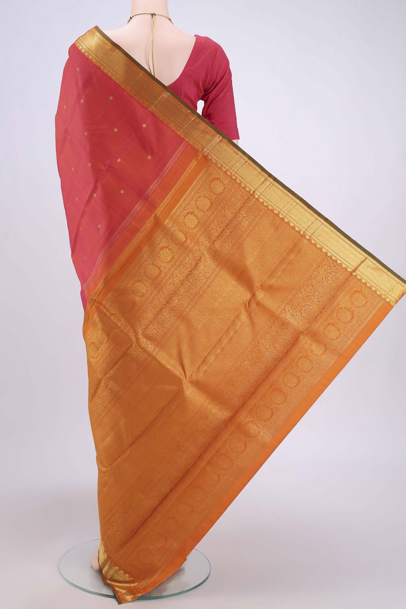 Flat view of Pure Silk Pure Zari Orange with Pink Dual Tone Kanjivaram Saree with Zari Butta on the body and Zari Border. 