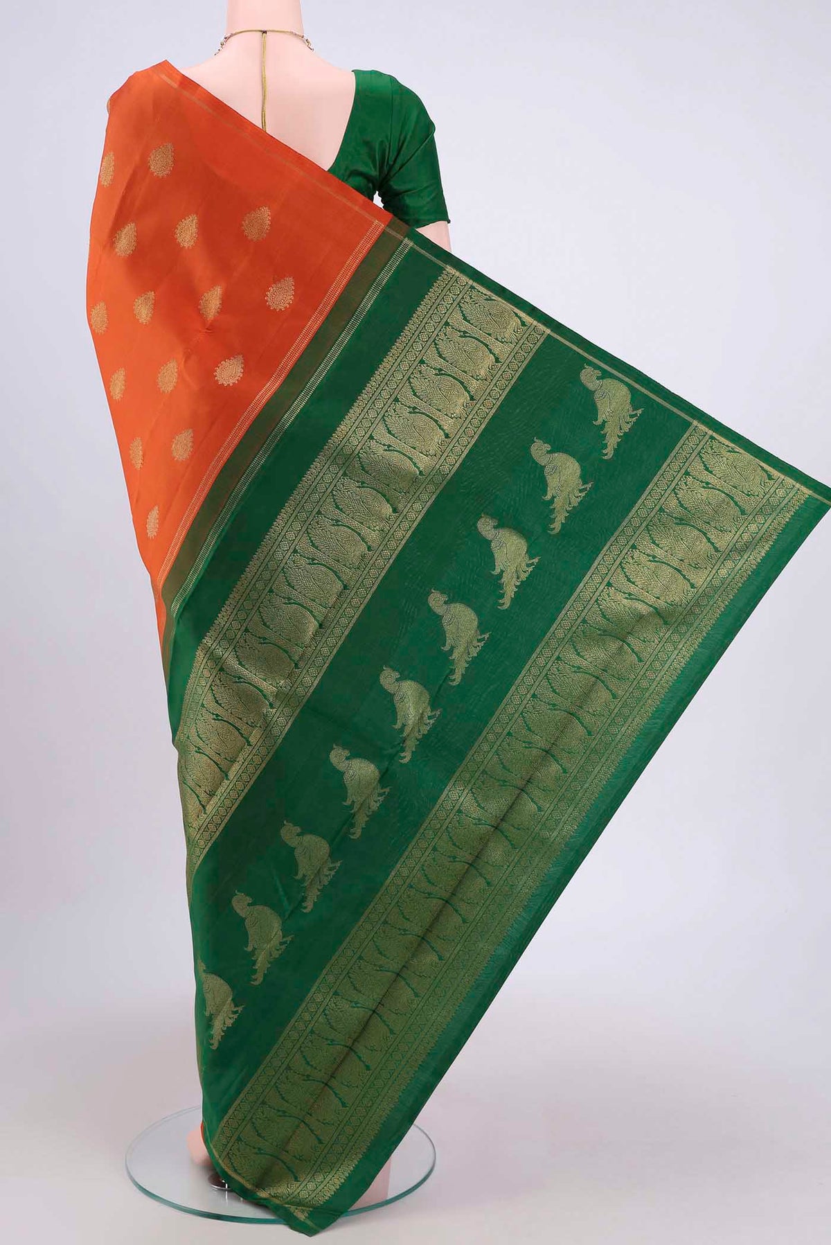 Flat view of Pure Silk Pure Zari Rust Kanchipuram Saree with Zari Butta on the body and Thin Zari Line. 