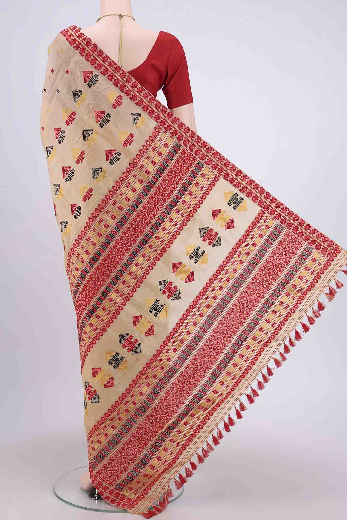 Flat view of Dark Beige Assam Silk Saree with Thread Butta on the body and Thread Border. 