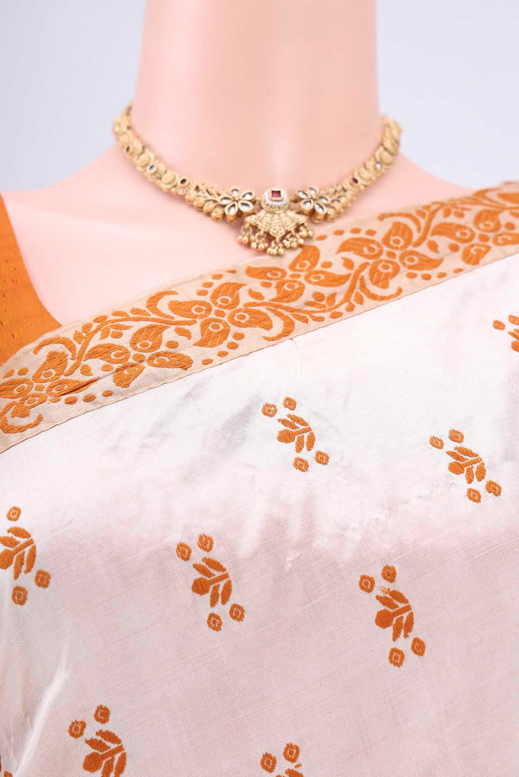 Border image of Cream Assam Silk Saree with Thread Butta on the body and Thread Border. 
