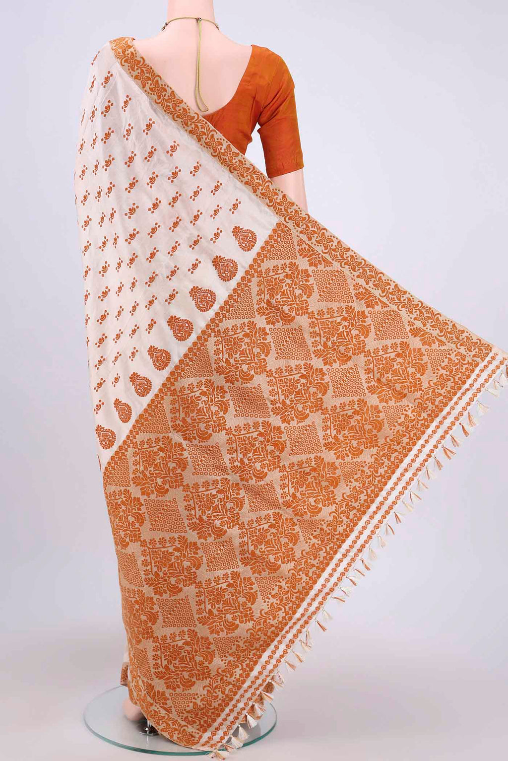 Flat view of Cream Assam Silk Saree with Thread Butta on the body and Thread Border. 