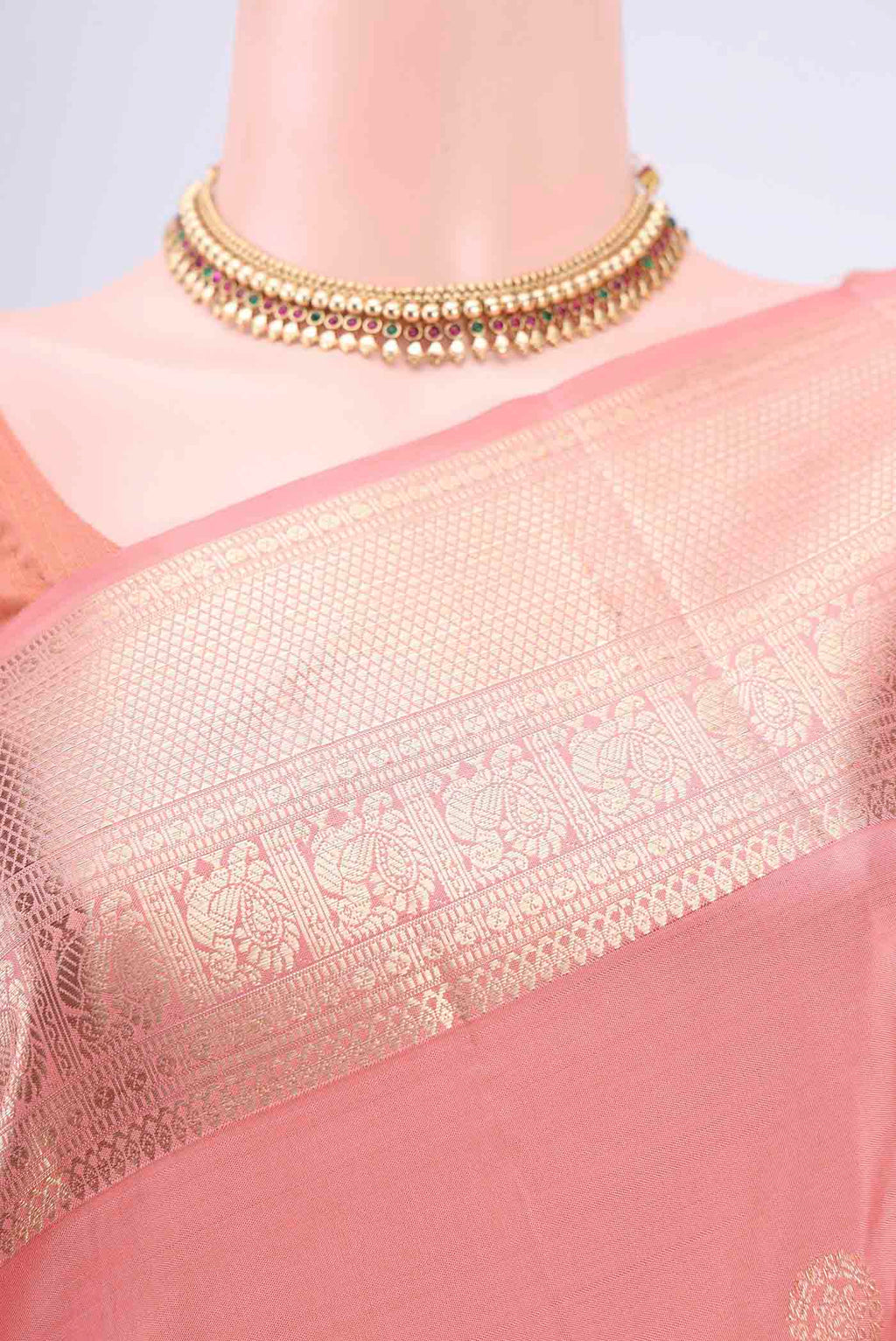 Border image of Peach Kanjivaram Saree with Zari Butta on the body and Zari Border. 