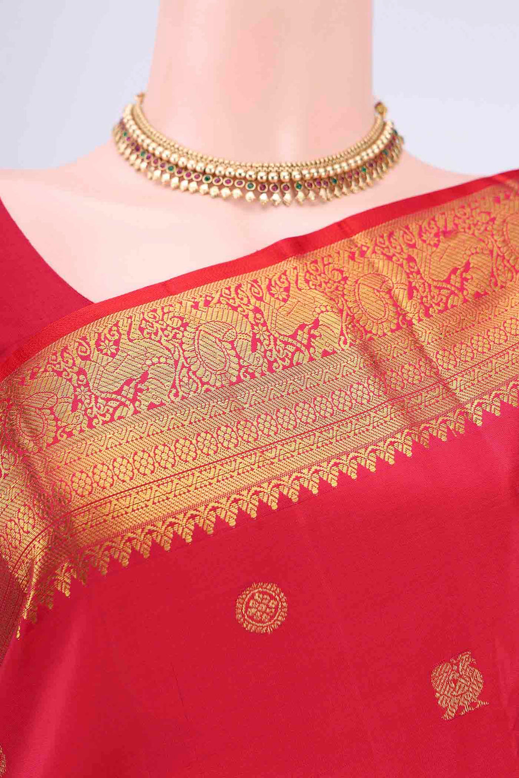 Border image of Red Kanjivaram Saree with Zari Butta on the body and Zari Border. 
