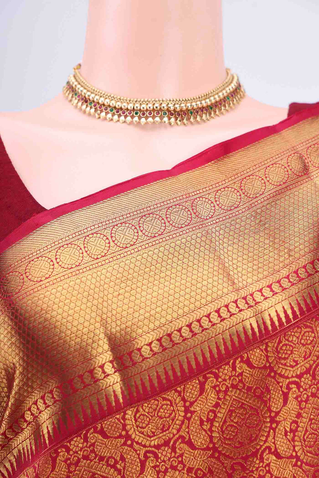 Border image of Maroon Kanchipuram Saree with Zari Brocade on the body and Zari Border. 